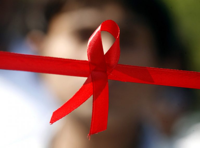 epa03492722 A red ribbon, the internationally known symbol of AIDS awareness, is photographed during an awareness campaign in Bhopal, India, on the occasion of World AIDS Day, 01 December 2012. The Acquired Immune Deficiency Syndrome (AIDS) is a disease caused by a virus called Human Immunodeficiency Virus (HIV). The illness alters the immune system, making people much more vulnerable to infections and diseases. World AIDS Day is annually celebrated on 01 December. EPA/SANJEEV GUPTA